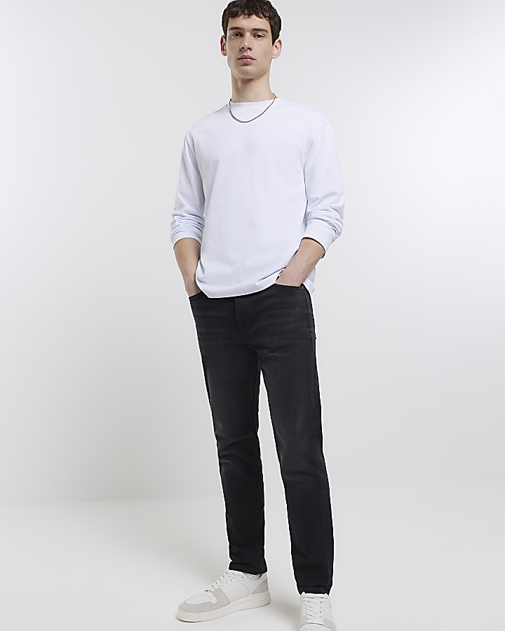 Black tapered fit jeans | River Island
