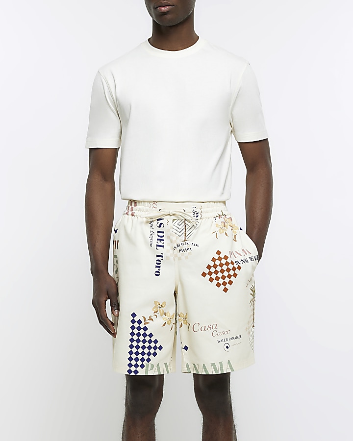Cream regular fit graphic print shorts