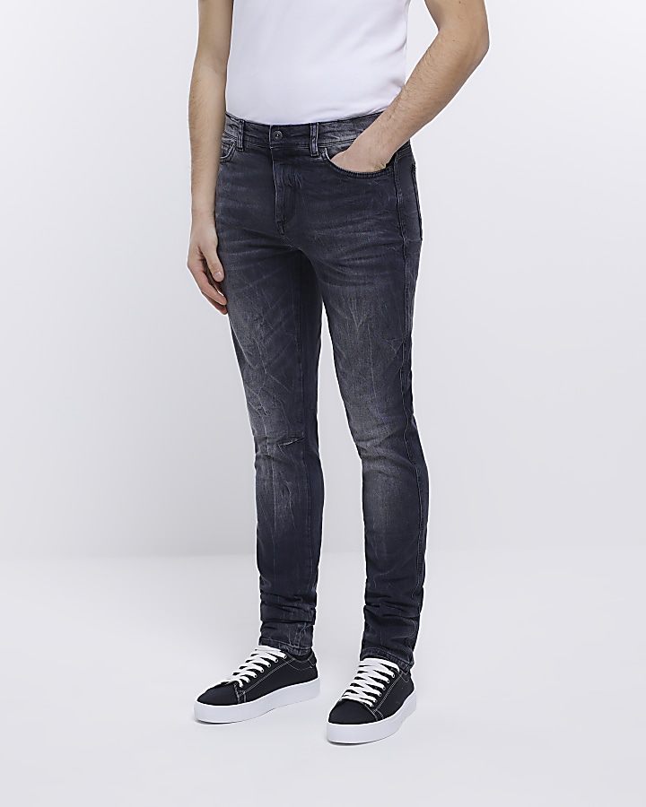 Black skinny fit faded stacked jeans