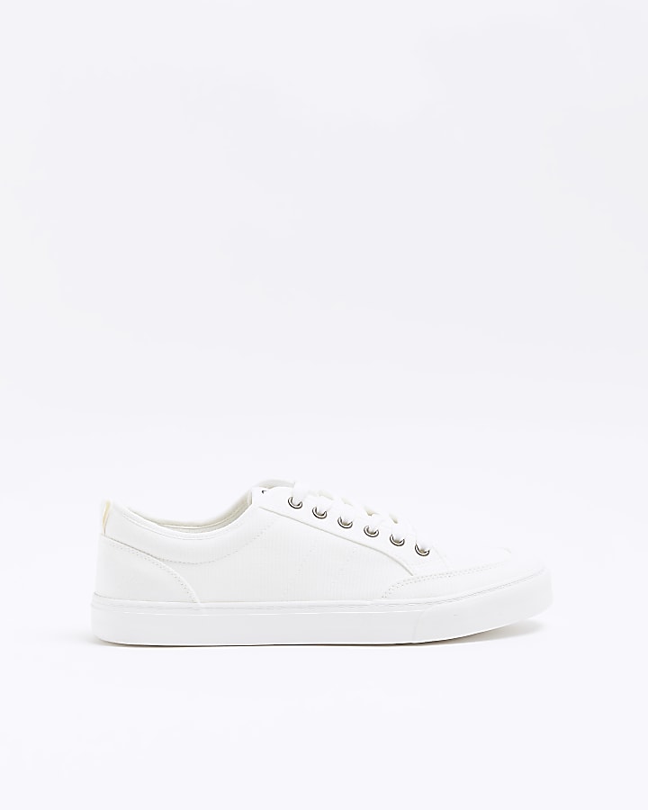 White canvas lace up trainers