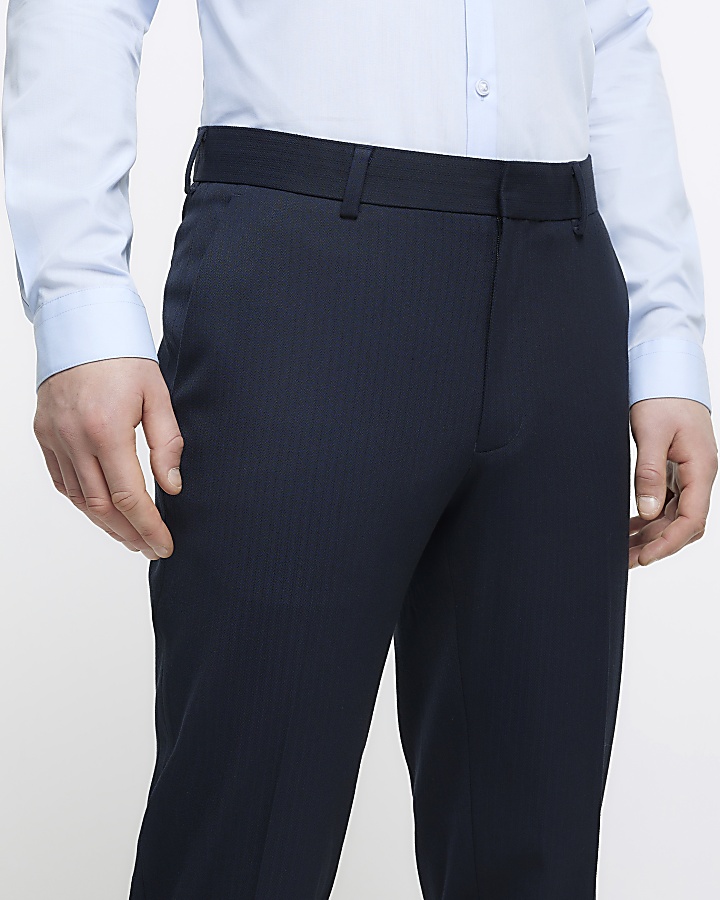 Navy skinny fit herringbone suit trousers | River Island