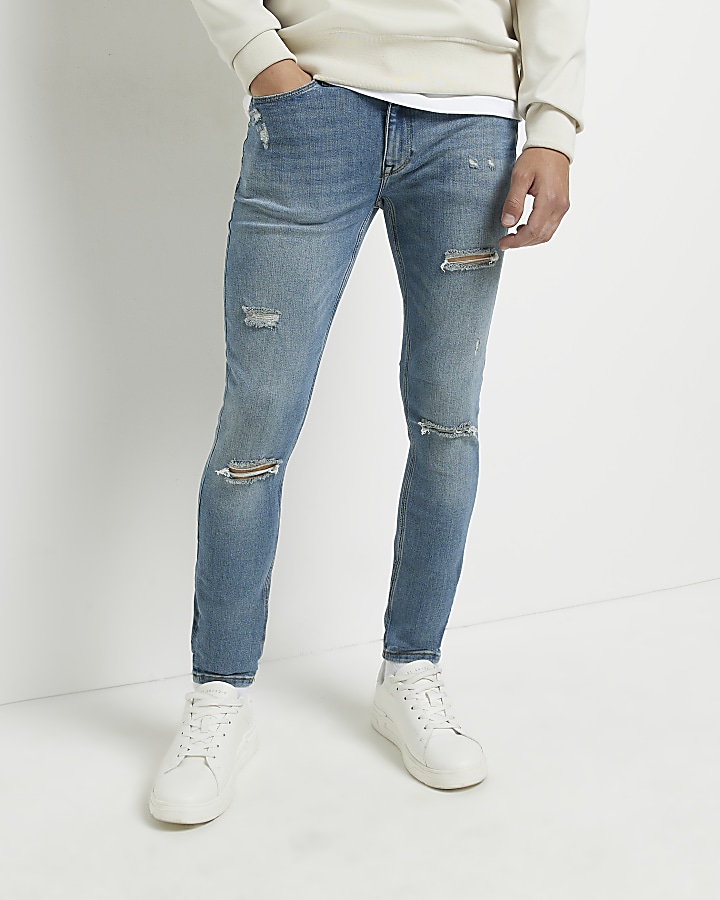 Blue spray on ripped skinny fit jeans | River Island