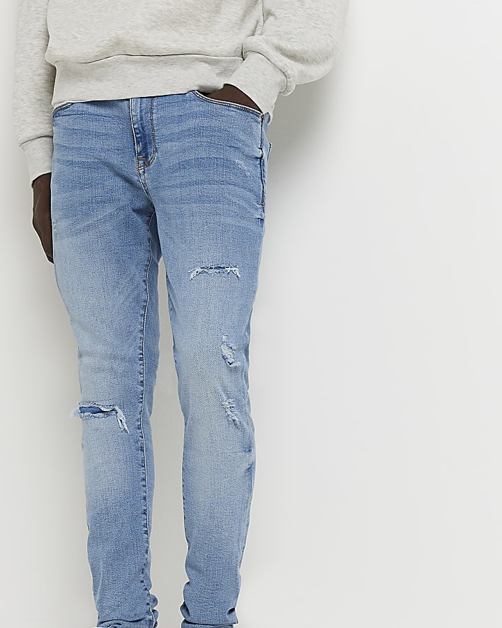 Light blue spray on ripped skinny fit jeans