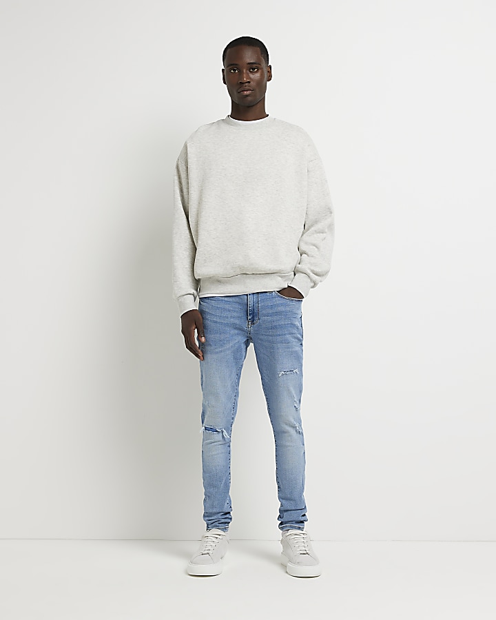 Light blue spray on ripped skinny fit jeans | River Island