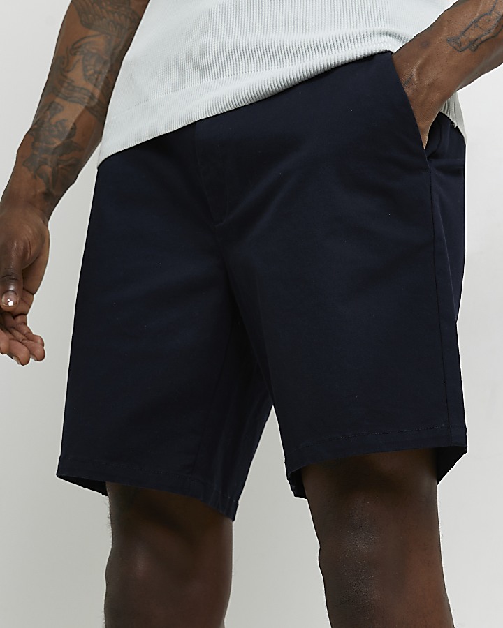 Navy skinny fit Chino Shorts | River Island