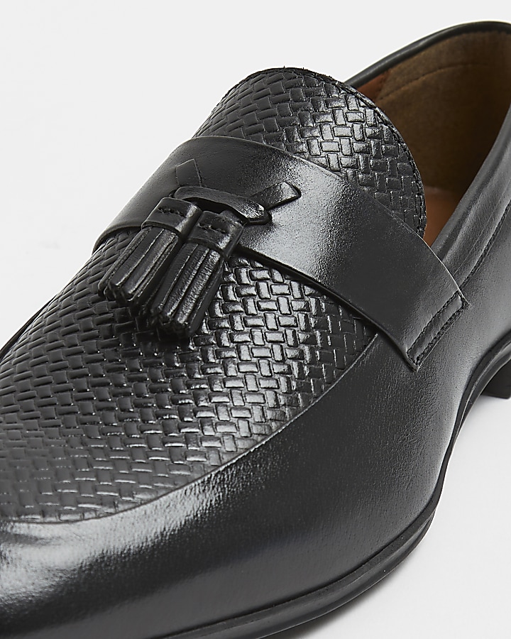 Black leather tassel detail embossed loafers
