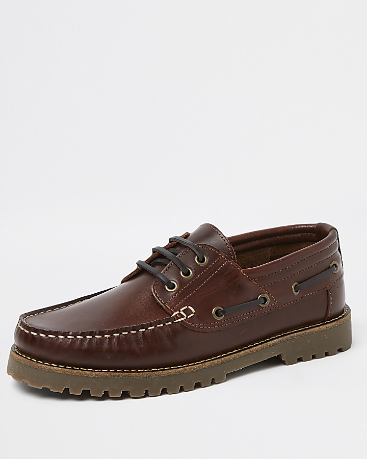 Brown leather cleated sole boat shoes
