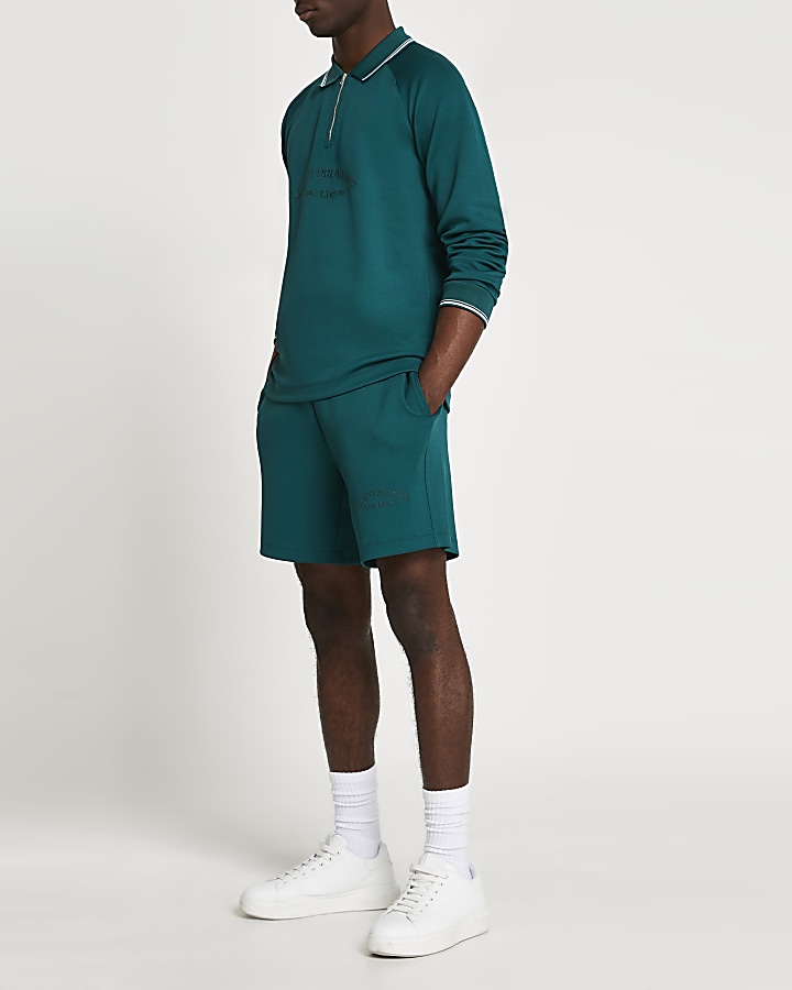 Green tropic tennis shorts