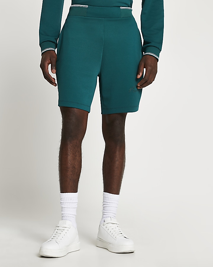 Green tropic tennis shorts