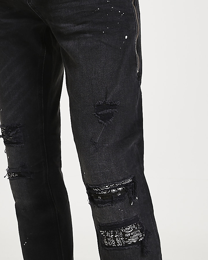 Black paint splat ripped slim-skinny jeans
