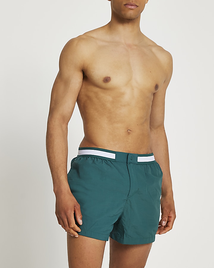 Green swim shorts