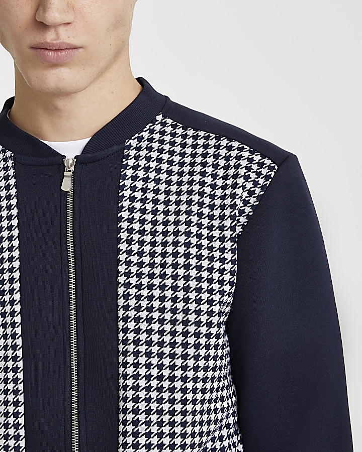 Navy dogtooth panelled bomber jacket