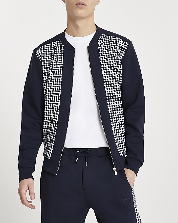 Navy dogtooth panelled bomber jacket