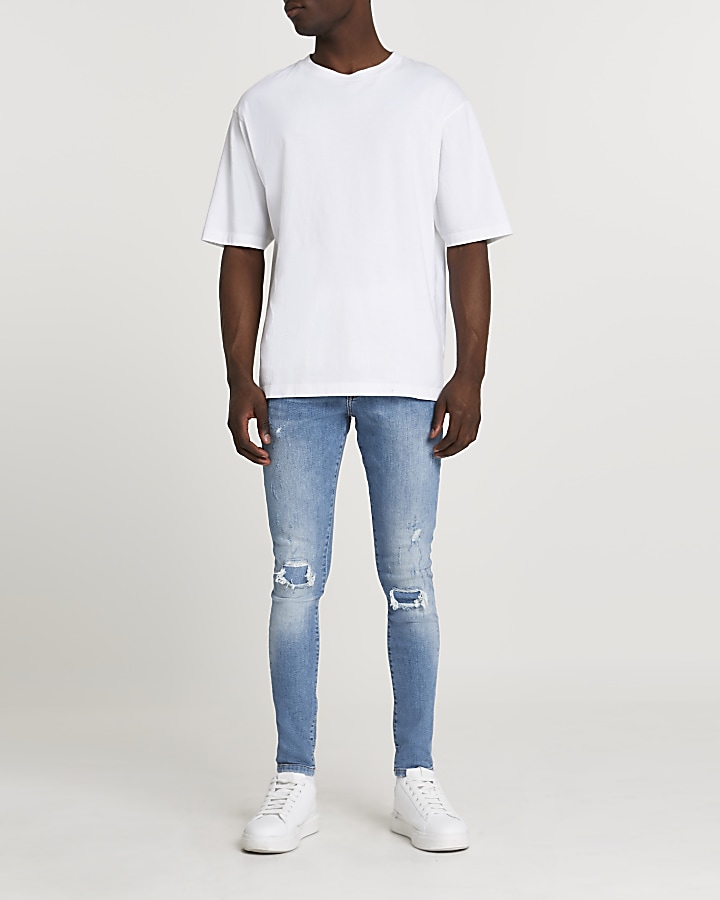 Blue ripped spray on skinny fit jeans