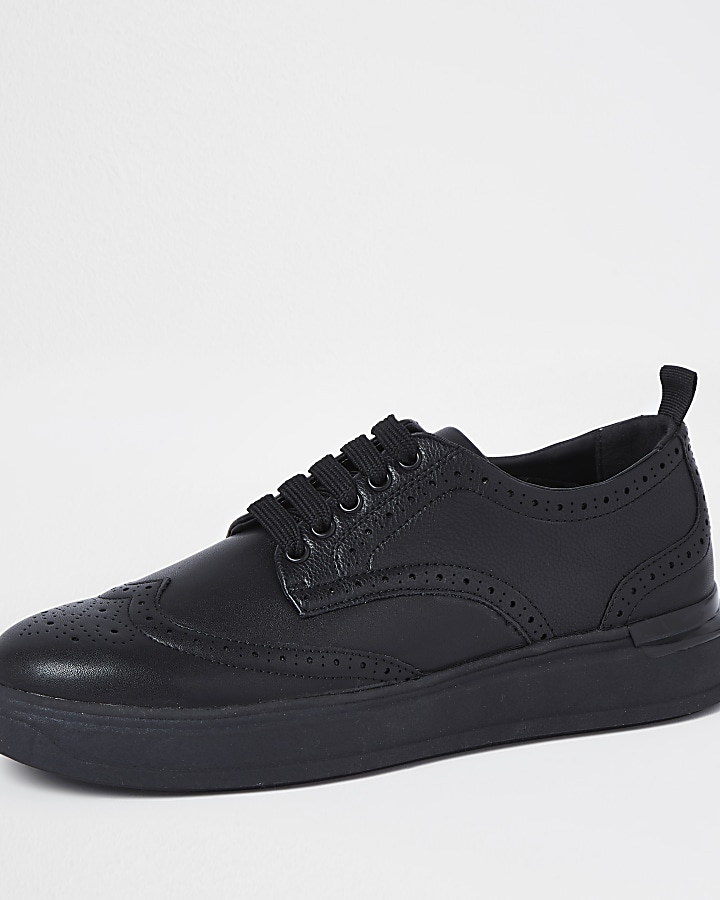 Black lace-up brogue wedge sole trainers