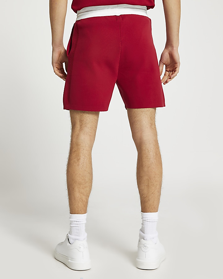 Red knit elasticated contrast waist shorts