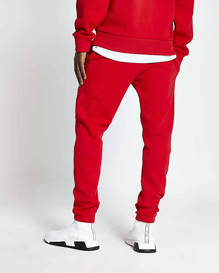 Red 'MCMLX' embroidered slim fit joggers