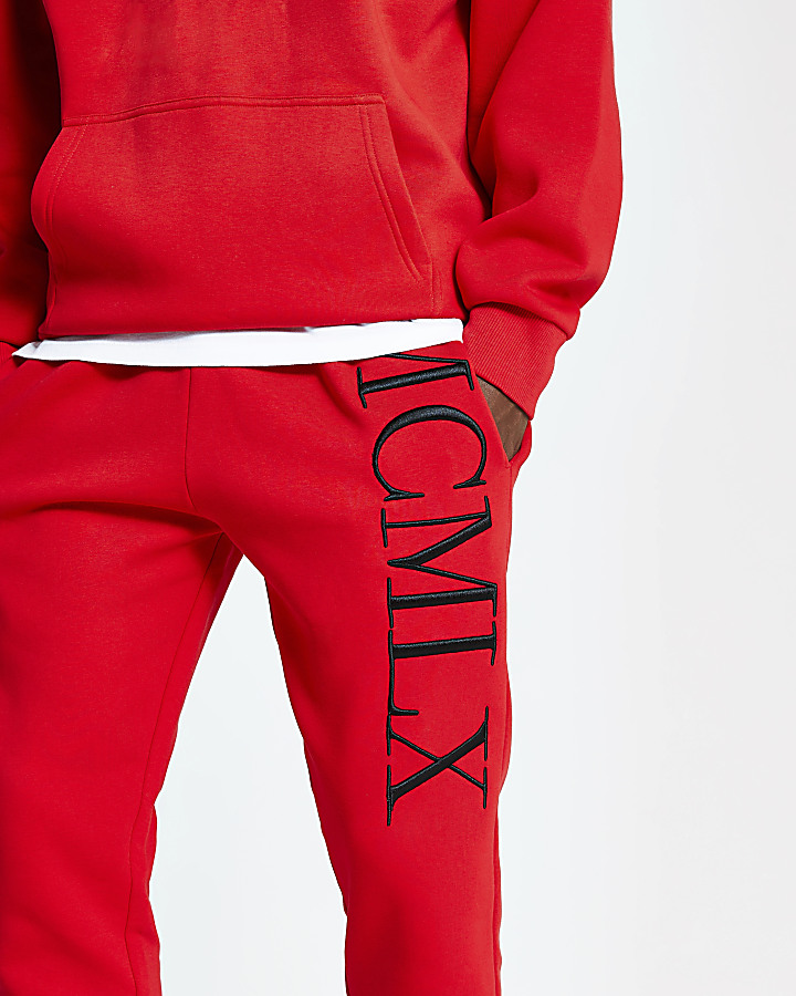 Red 'MCMLX' embroidered slim fit joggers
