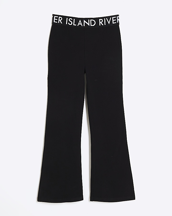 Girls black elasticated flare trousers