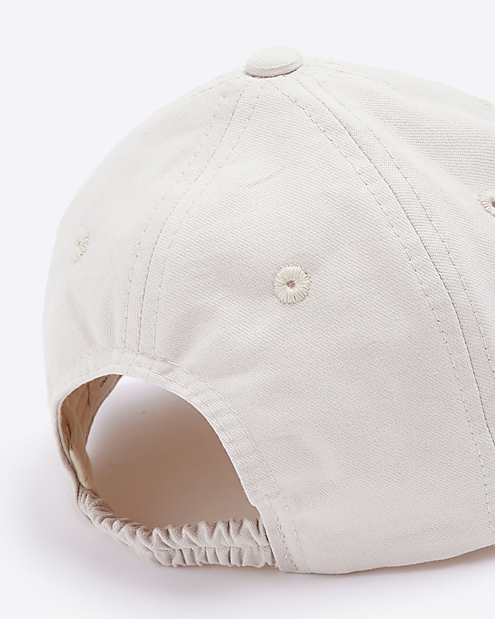 Mini cream embossed cap