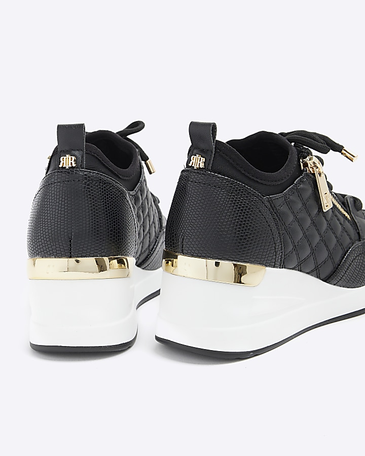 Girls black quilted wedge trainers