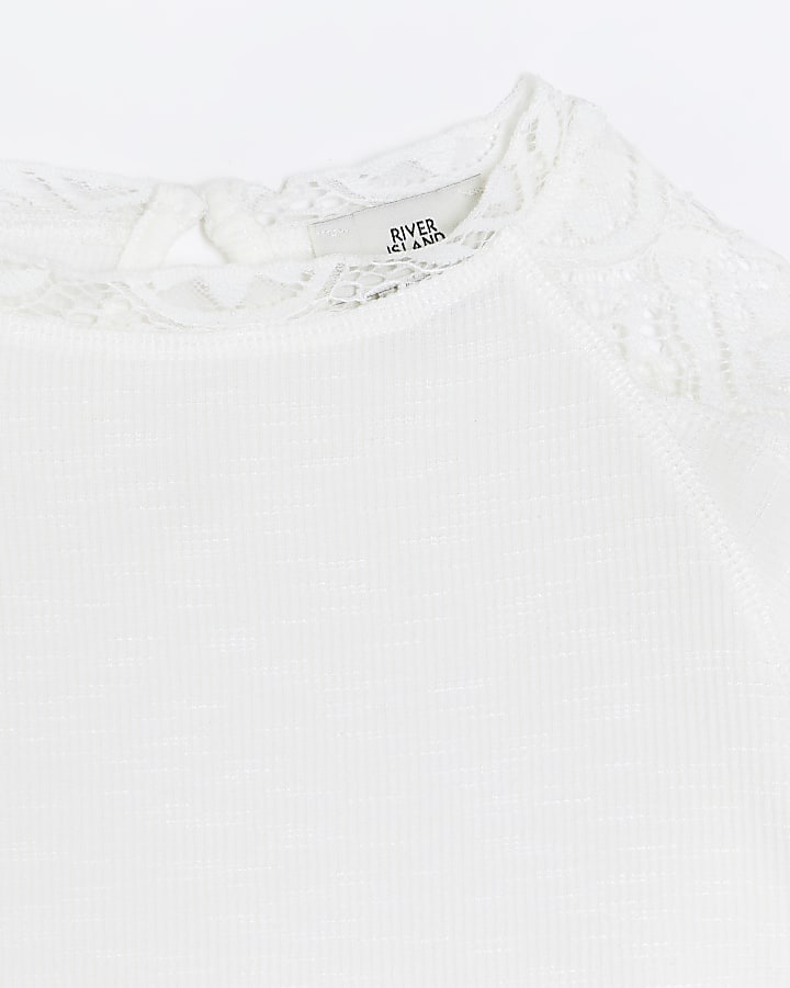 Girls cream lace detail long sleeve top | River Island
