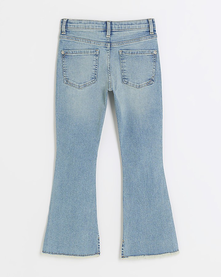 Girls blue ripped flare jeans | River Island
