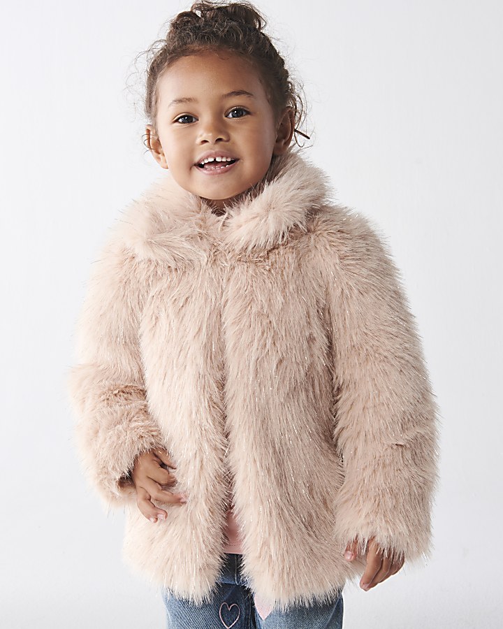 Girls in store fur coat