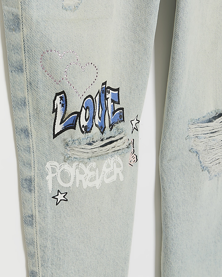 Blue graffiti ripped jeans