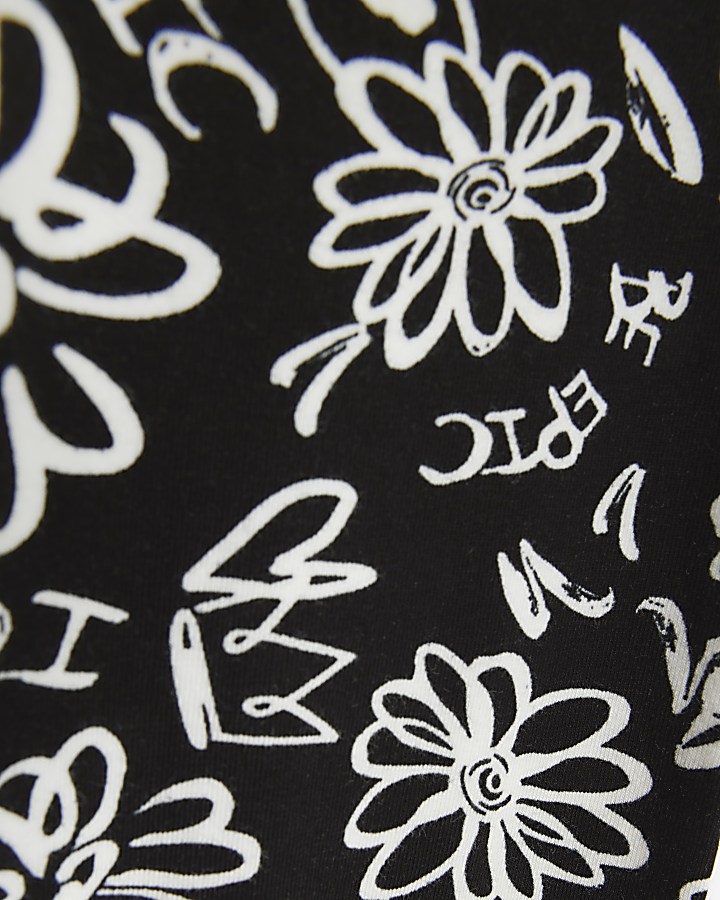 Girls black floral graffiti print leggings