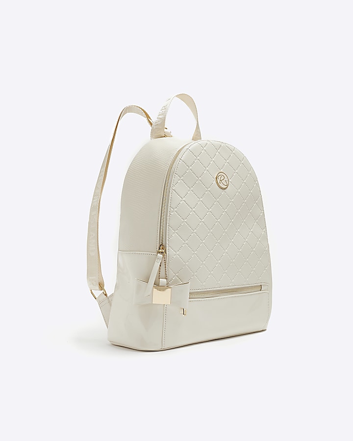 Girls cream quilted bow detail backpack | River Island
