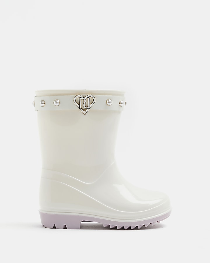 Mini girls cream RI heart pearl wellie boots | River Island