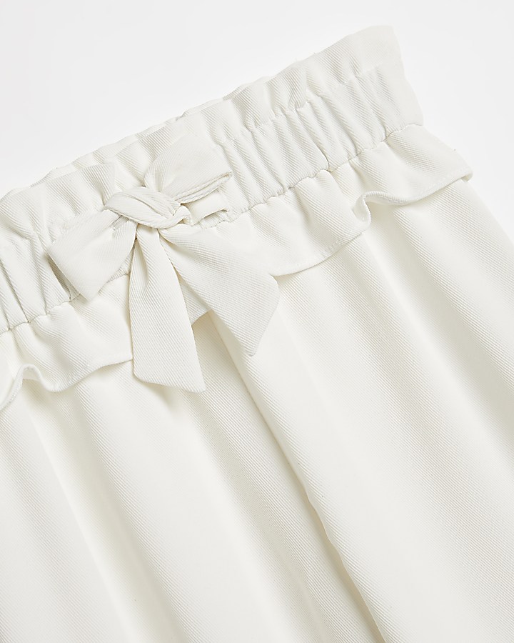 Girls white frill bow wide leg trousers