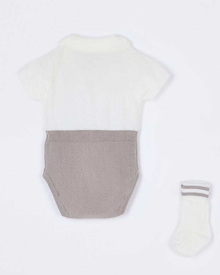 Baby ecru knit babygrow and sock set