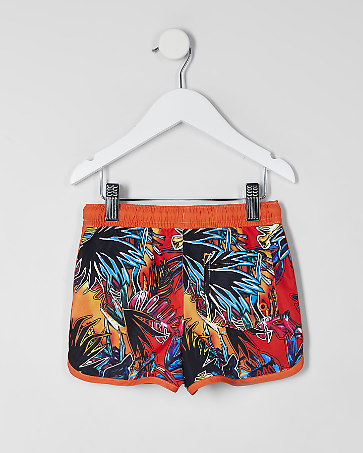 Mini boys orange tropical print swim shorts