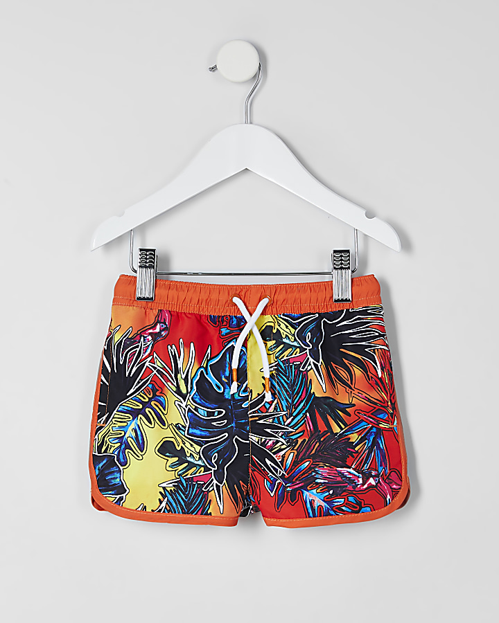 Mini boys orange tropical print swim shorts