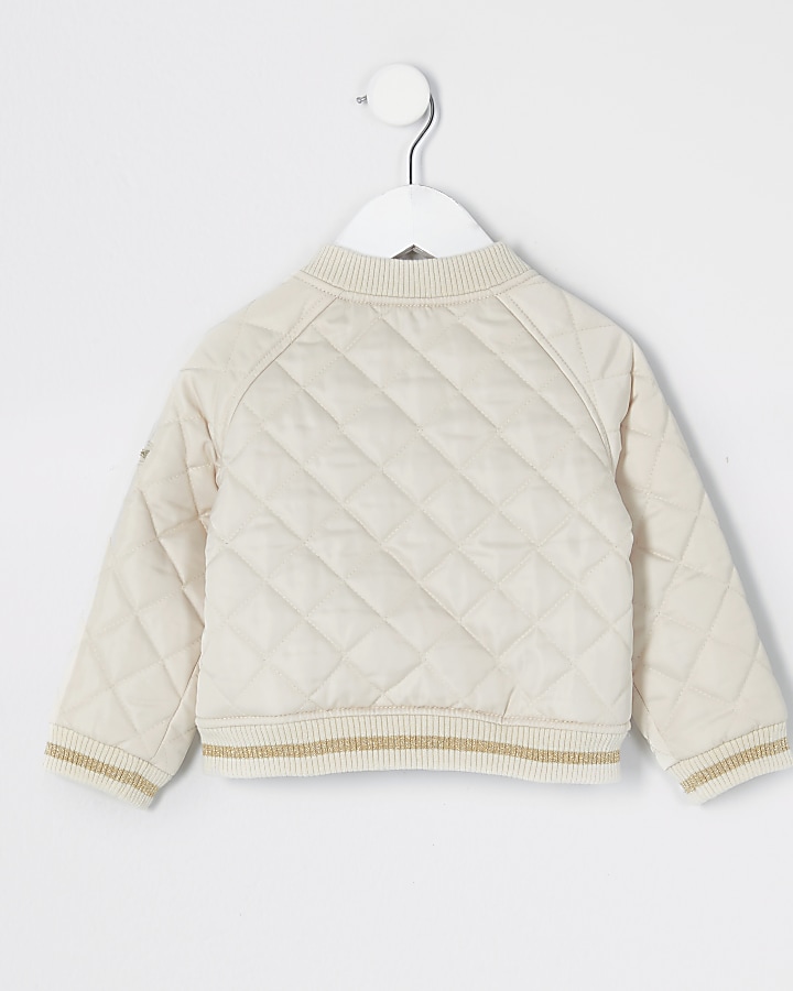 Mini girls cream quilted bomber jacket