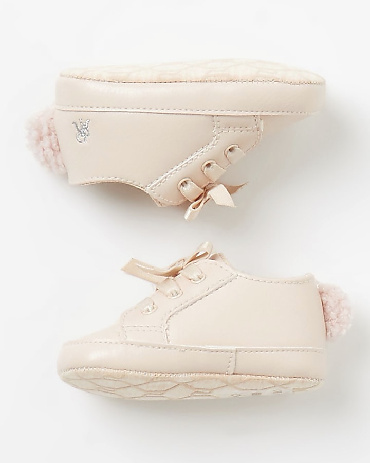 Baby pink pom pom lace-up trainers