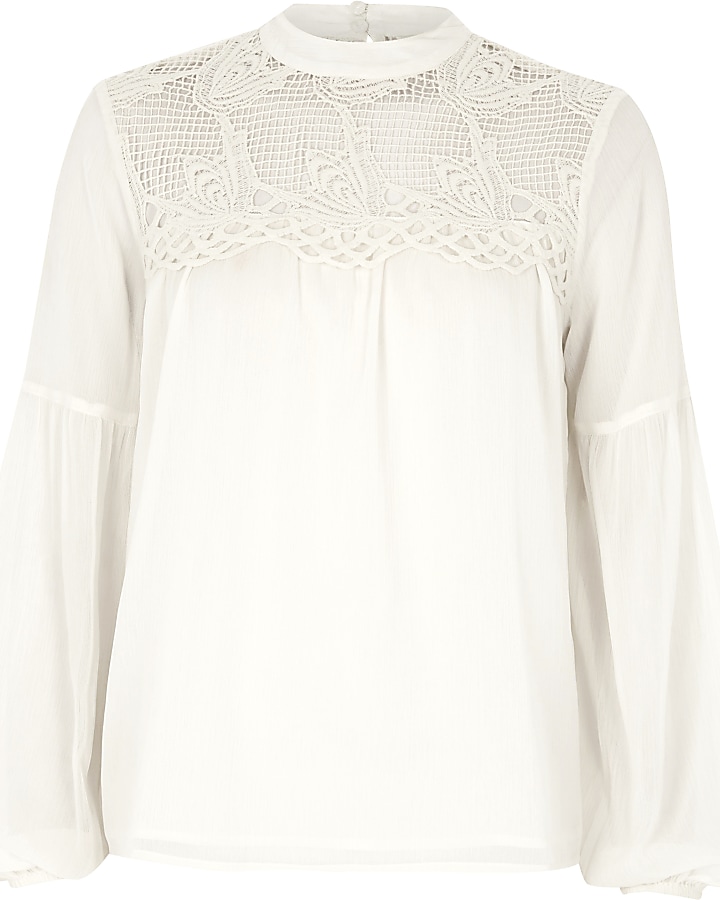 Cream cutwork bell sleeve blouse