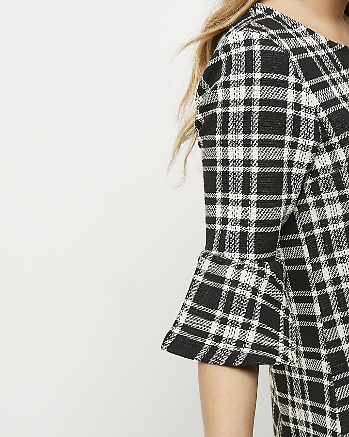 Black and white check flute sleeve dress