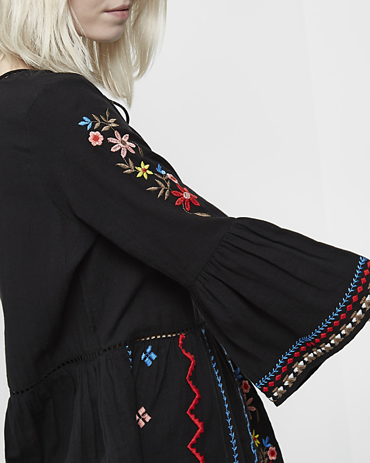 Petite black embroidered bell sleeve top