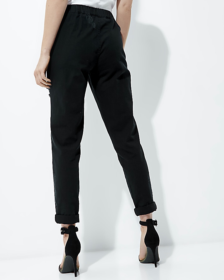 Black ripped tapered trousers