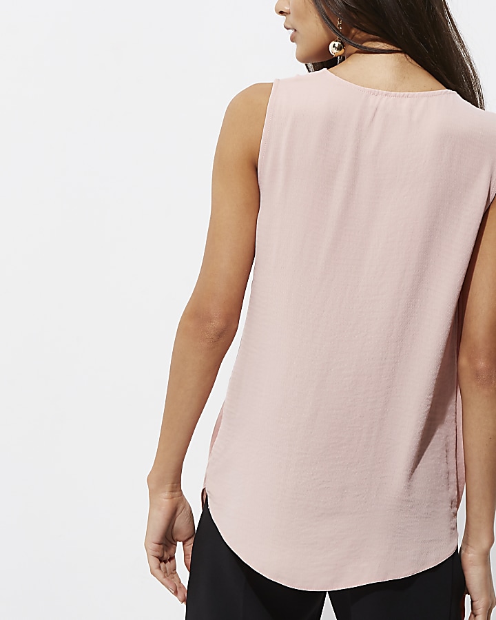 Light pink knot front sleeveless blouse
