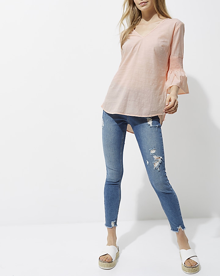 Light pink shirred bell sleeve top