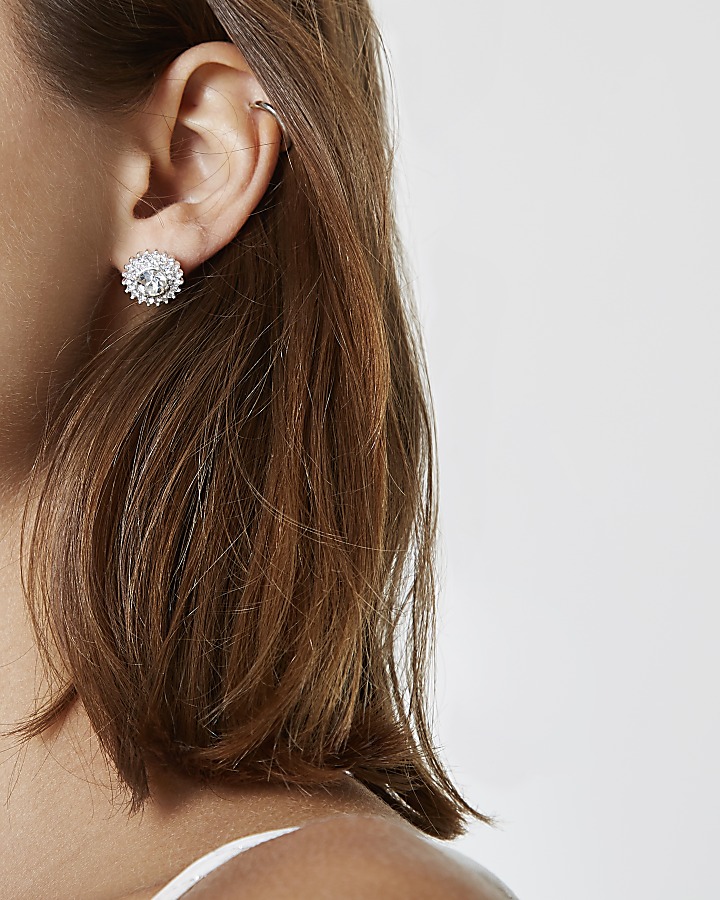 Silver tone diamante starburst stud earrings