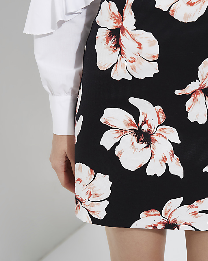 Black floral print mini skirt