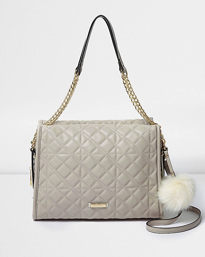 Grey quilted pom pom chain handle tote bag