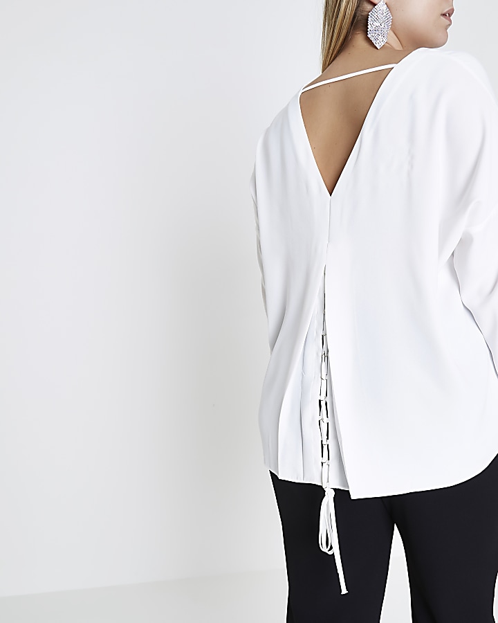 Plus cream lace-up back long sleeve top