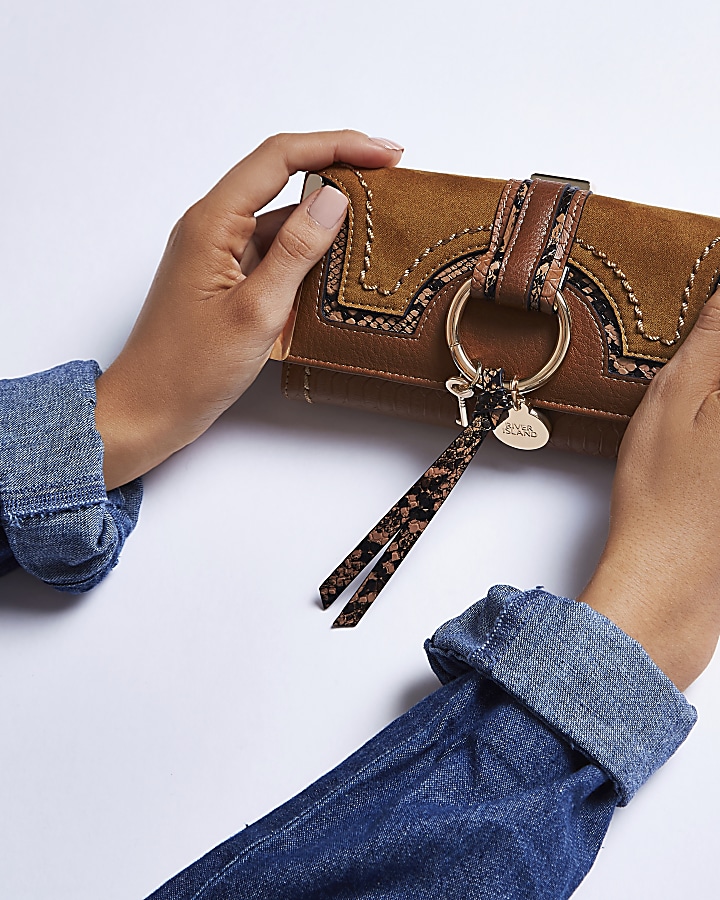 Tan brown snake embossed hoop clip top purse