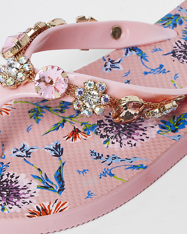 Pink jewel embellished flip flops